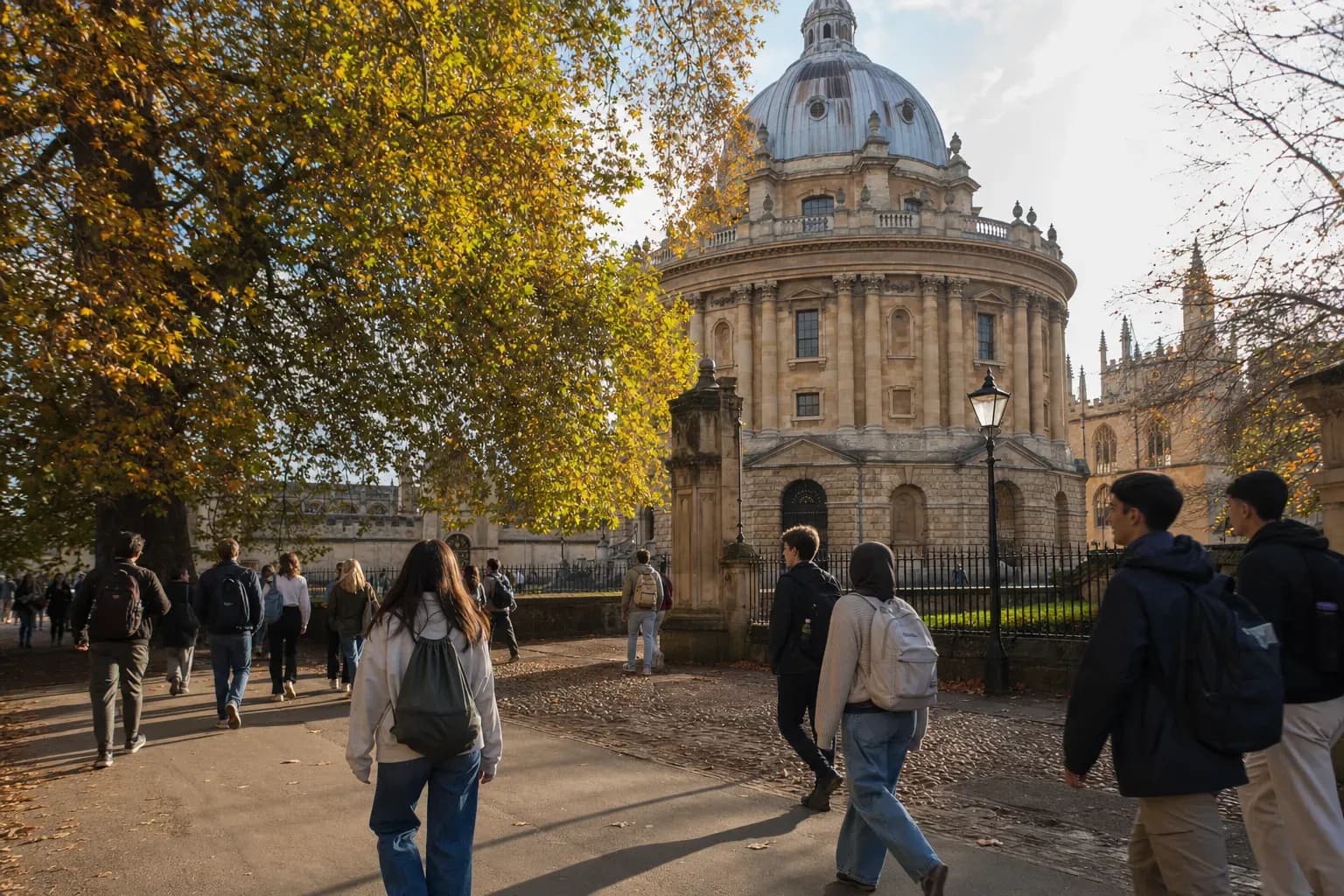 A realistic campus photograph of the iconic landmarks of University of Oxford with students walking